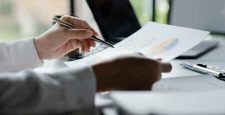 Business men are looking at the company's financial documents to