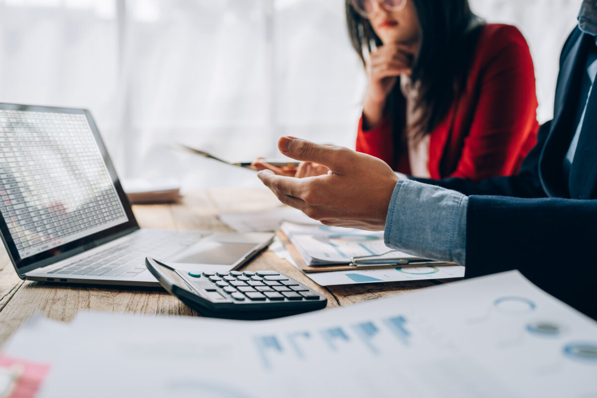 startup business, business advisor explaining strategy for planning finance investment teamwork paperwork audit and discussing marketing, profit, budget of company in meeting room.